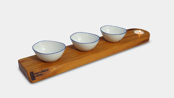 handgefertigtes Apéro-Set der Manufaktur Nissen aus schweizer Ulmenholz mit integriertem Teelichthalter und 3 veganen Porzellanschälchen